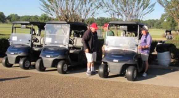 Golf carts lined up at Bent Brook Golf Course