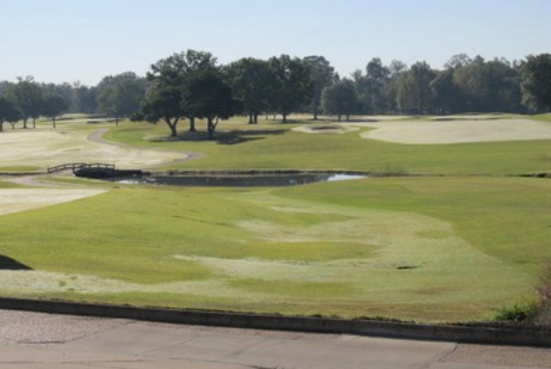 Bent Brook Golf Course fairway with bridge and pond