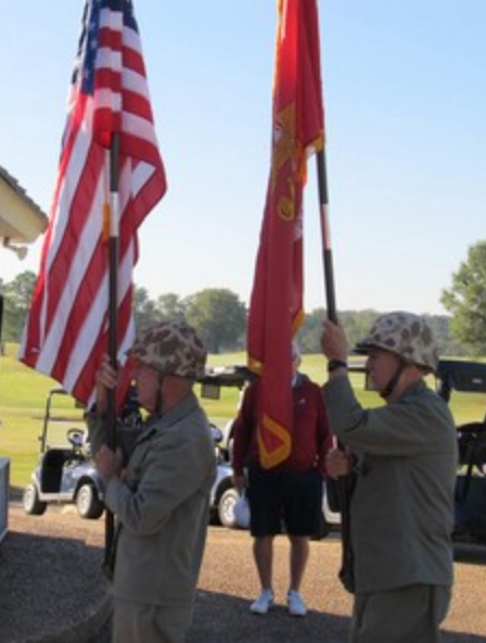Color guard raising flags at golf tournament