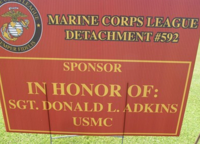 Sponsor sign in honor of SGT Donald L. Adkins USMC