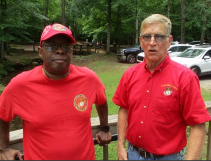 Two members in red Marine Corps shirts
