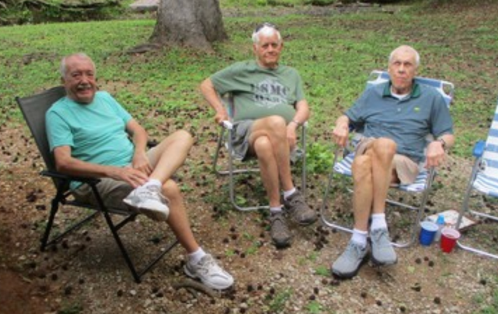 Two members in red Marine Corps shirts at event