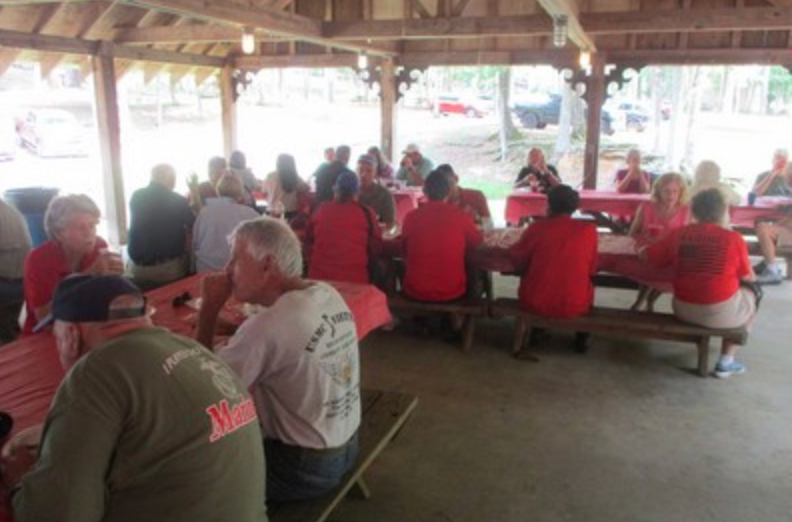 Group gathered in covered pavilion