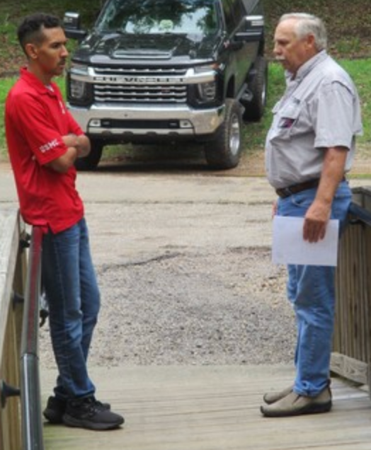 Two members in conversation on boardwalk