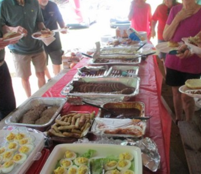 Members serving themselves at the food buffet line