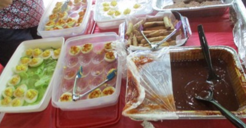 Deviled eggs and appetizers on buffet table