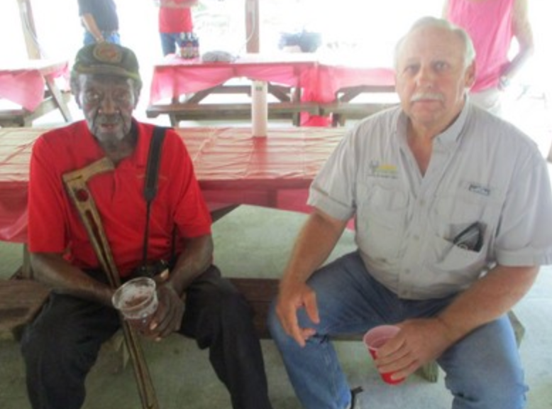 Two members seated at pavilion