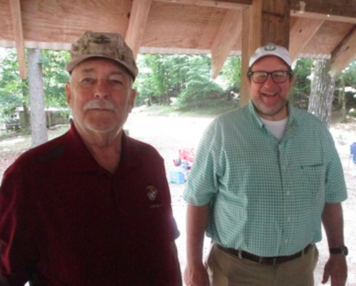 Two members under pavilion roof