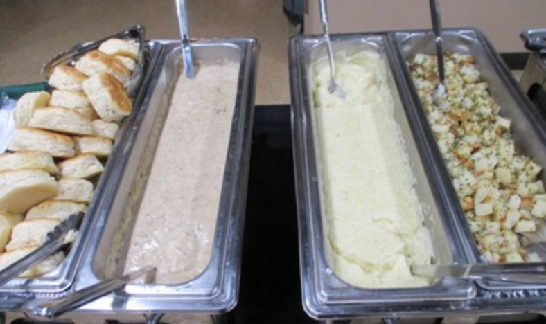 Buffet trays with biscuits, gravy, mashed potatoes and stuffing