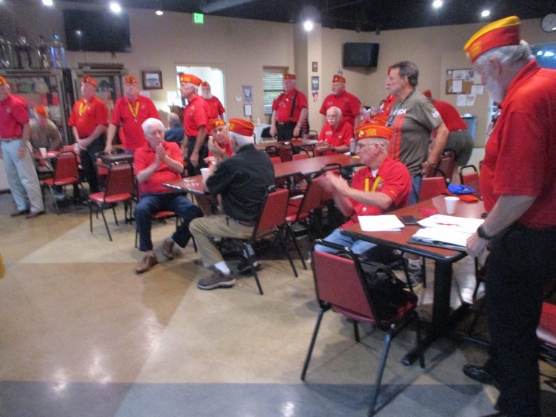 Group wearing red shirts community gathering indoors