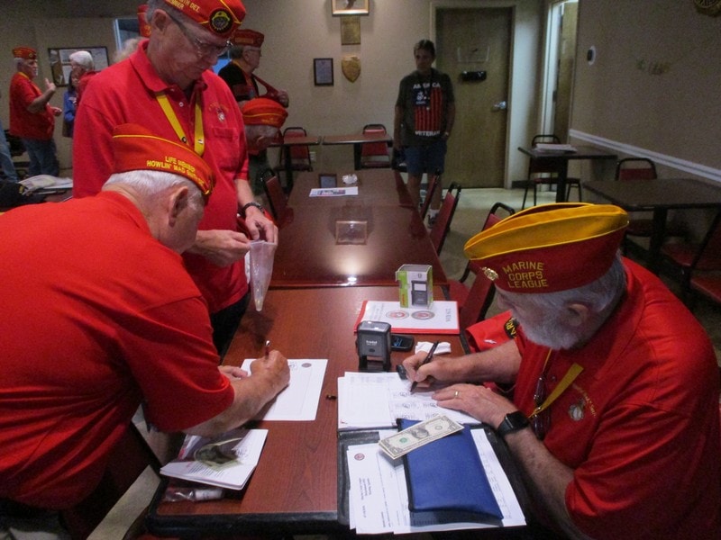 Marine Corps League veterans signing documents