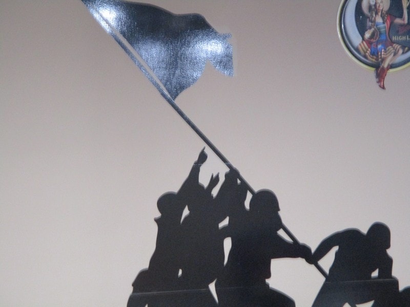 Members raising flag together