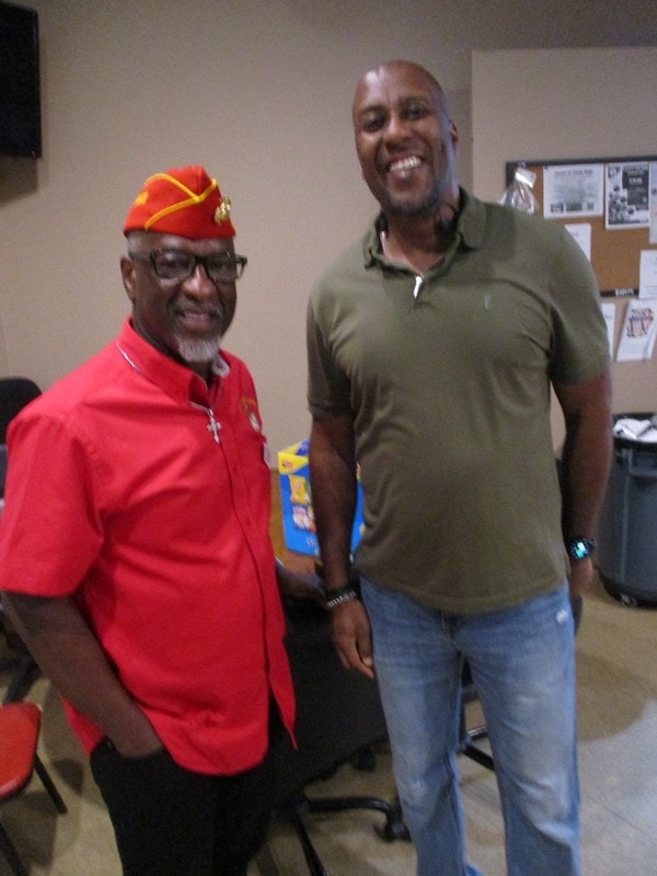Two members smiling together indoors