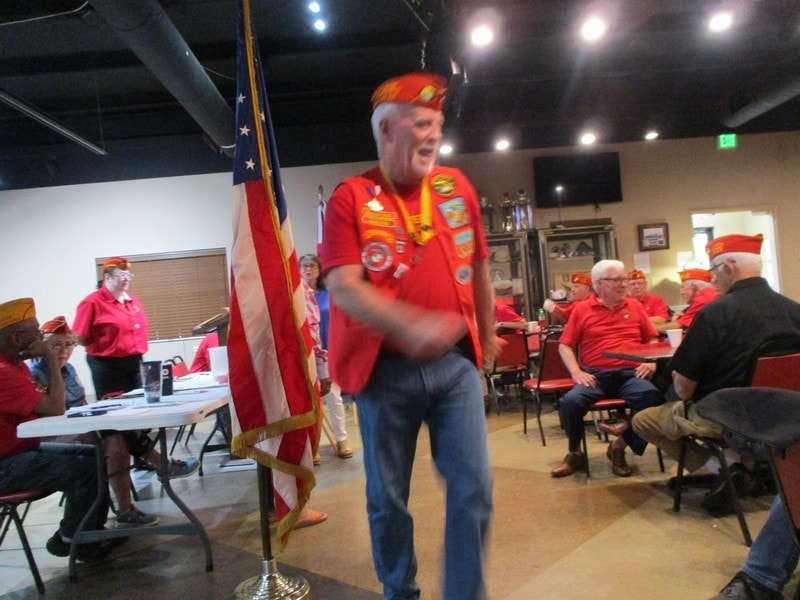 Member addressing indoor community gathering
