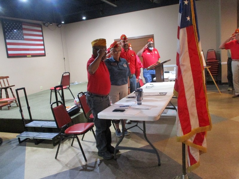Community meeting with American flags