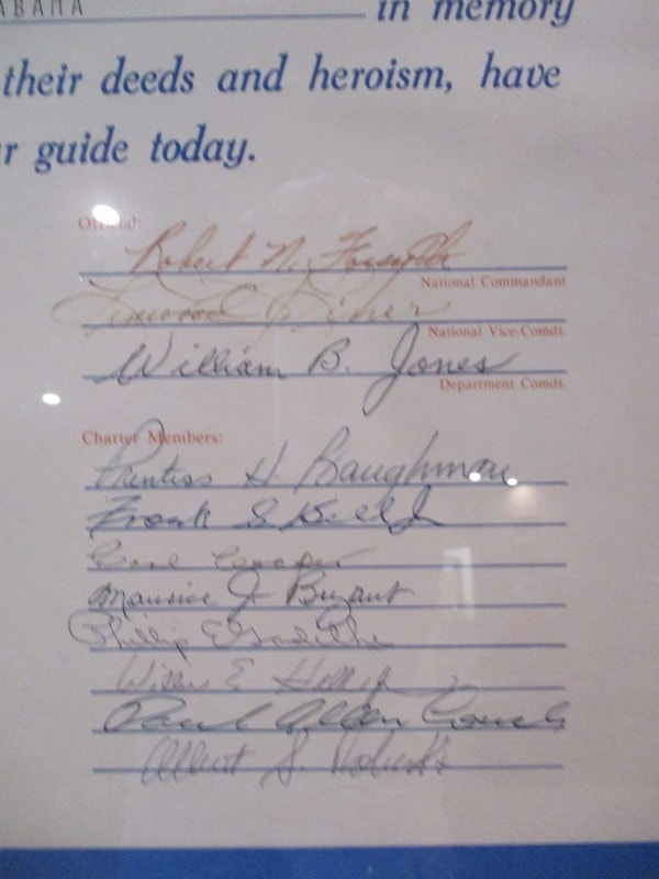 Historical memorial document with handwritten signatures