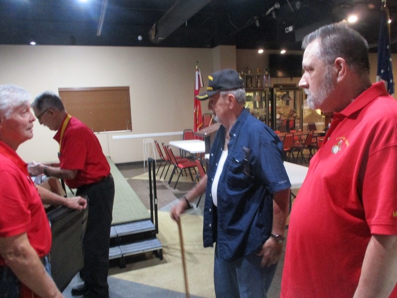 Group of members conversing indoors at event
