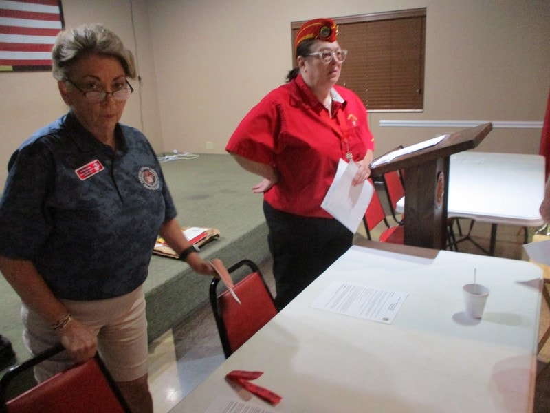 Veterans presenting at community meeting indoors