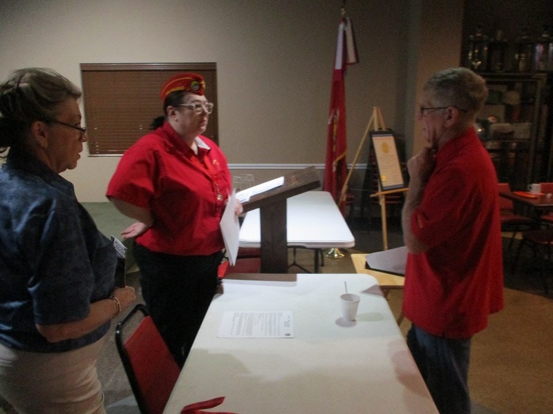 Three members meeting at table indoors