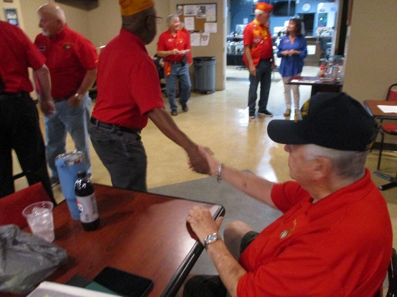 Group in red shirts at community gathering