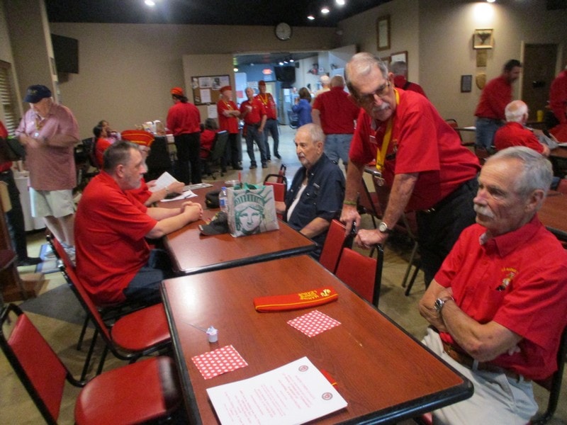Group of volunteers in red shirts at community event