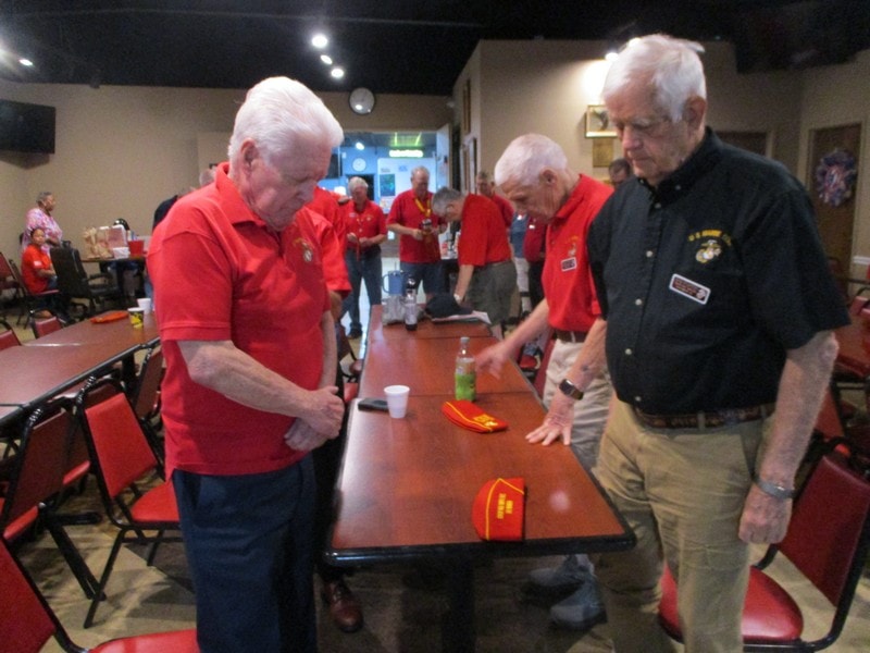 Senior members in red shirts at community event