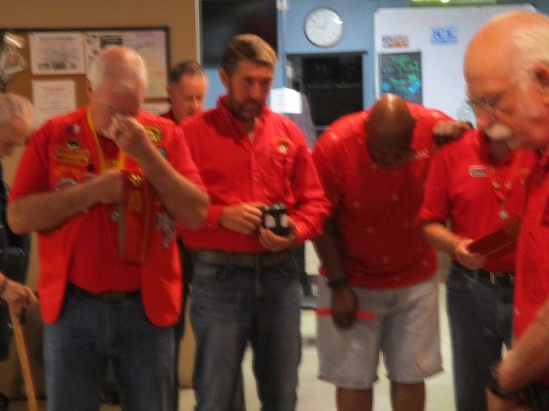 Group of members wearing red shirts indoors