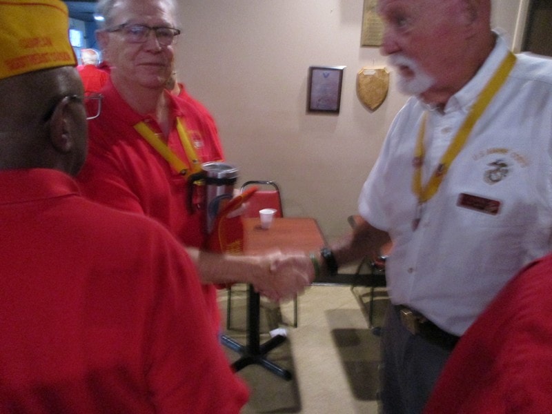 Members shaking hands indoors