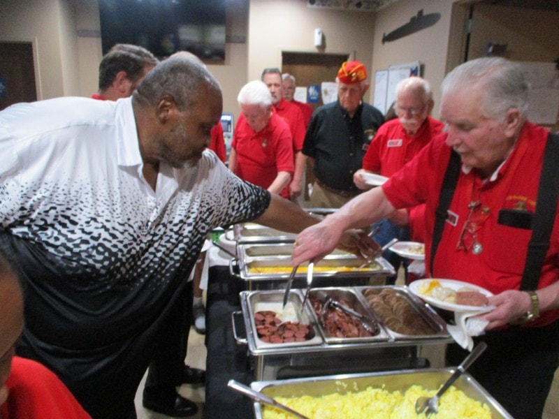 Volunteers serving food at community event