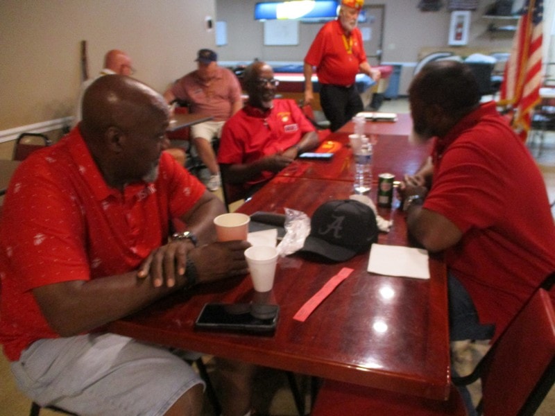 Group meeting in red shirts indoors