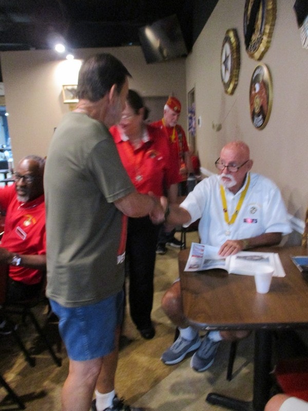 Member signing autograph for scouts