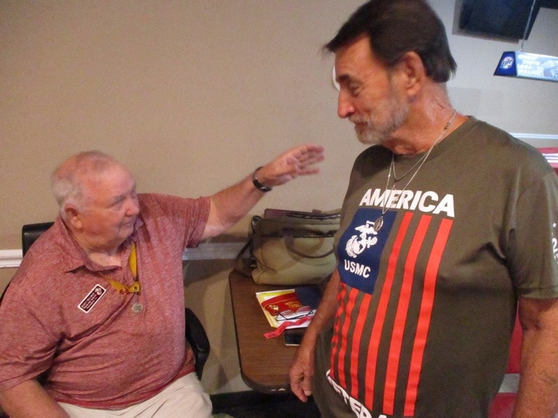 Two members having conversation indoors