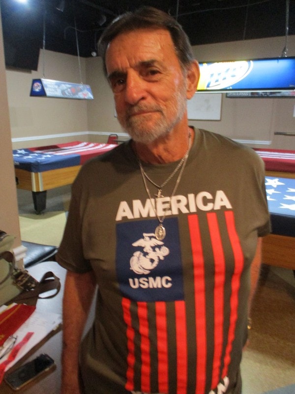 Member wearing USMC America patriotic shirt