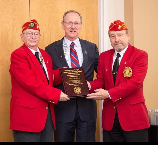 Marines presenting award plaque at VA hospital